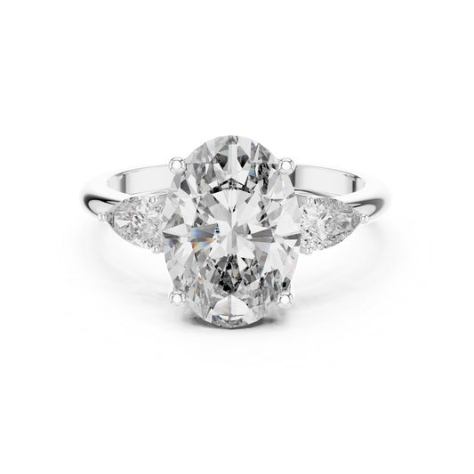 Pear Cut Diamond Ring with Oval Side Stones | Grace Meets Glamour