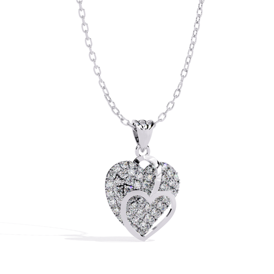 White gold double heart pendant showcasing a round pavé diamond–set solid heart layered with a clean open heart frame in front view