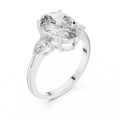 Pear Cut Diamond Ring with Oval Side Stones | Grace Meets Glamour