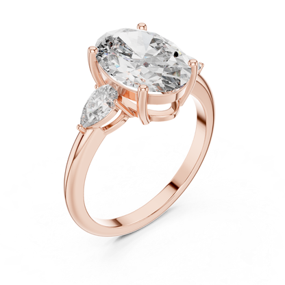Pear Cut Diamond Ring with Oval Side Stones | Grace Meets Glamour