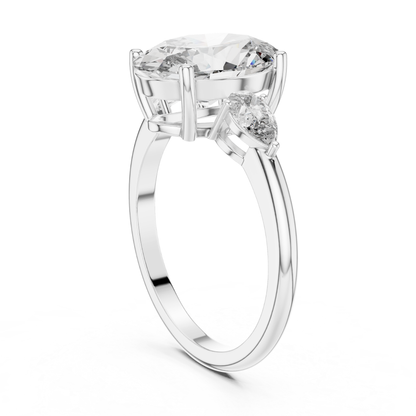 Pear Cut Diamond Ring with Oval Side Stones | Grace Meets Glamour