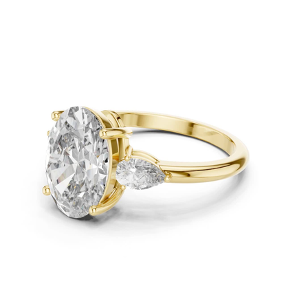 Pear Cut Diamond Ring with Oval Side Stones | Grace Meets Glamour