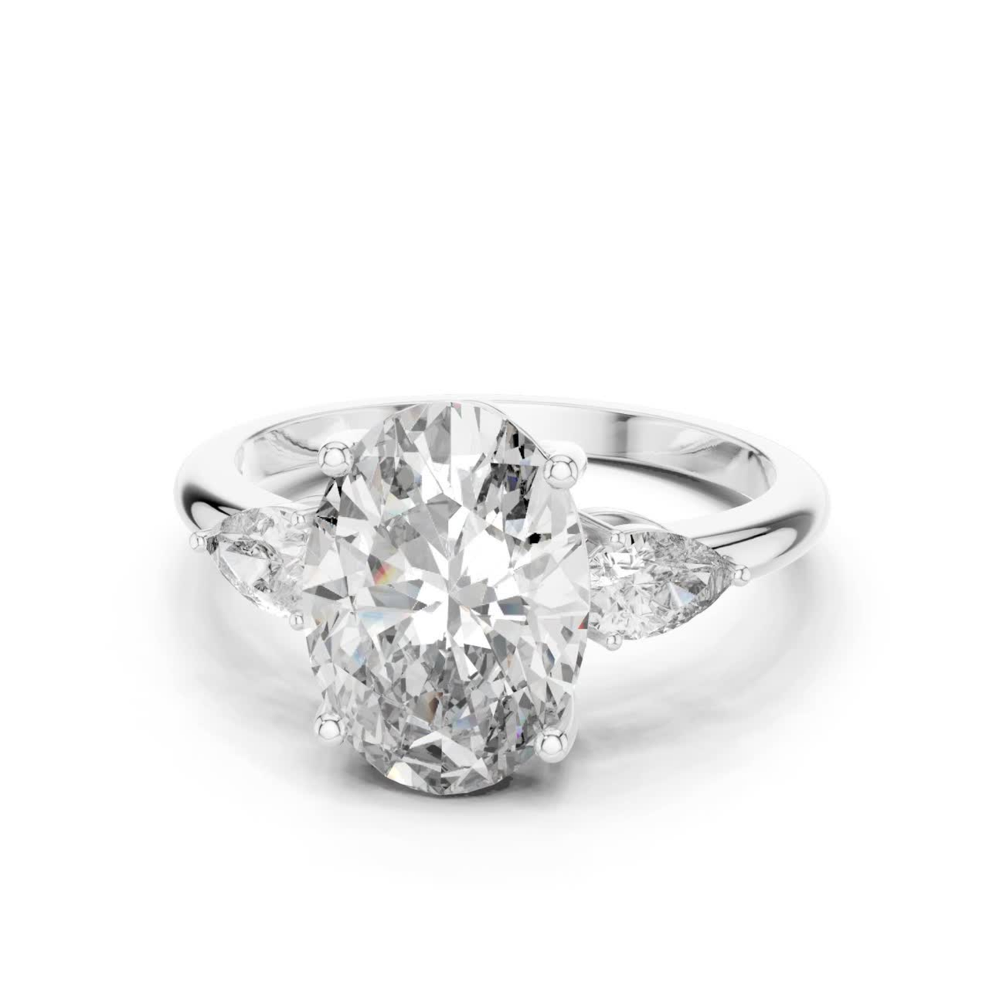 Pear Cut Diamond Ring with Oval Side Stones | Grace Meets Glamour