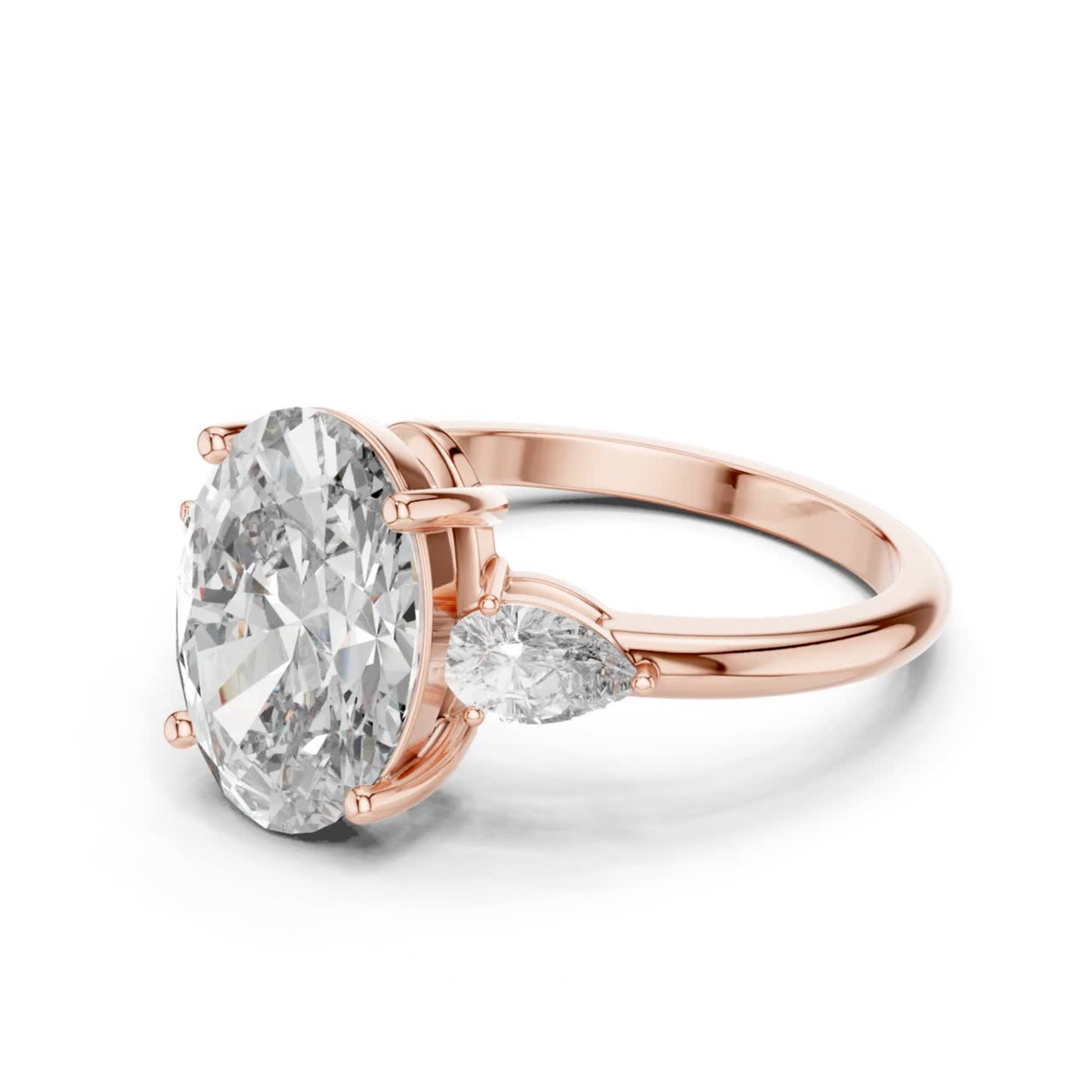 Pear Cut Diamond Ring with Oval Side Stones | Grace Meets Glamour