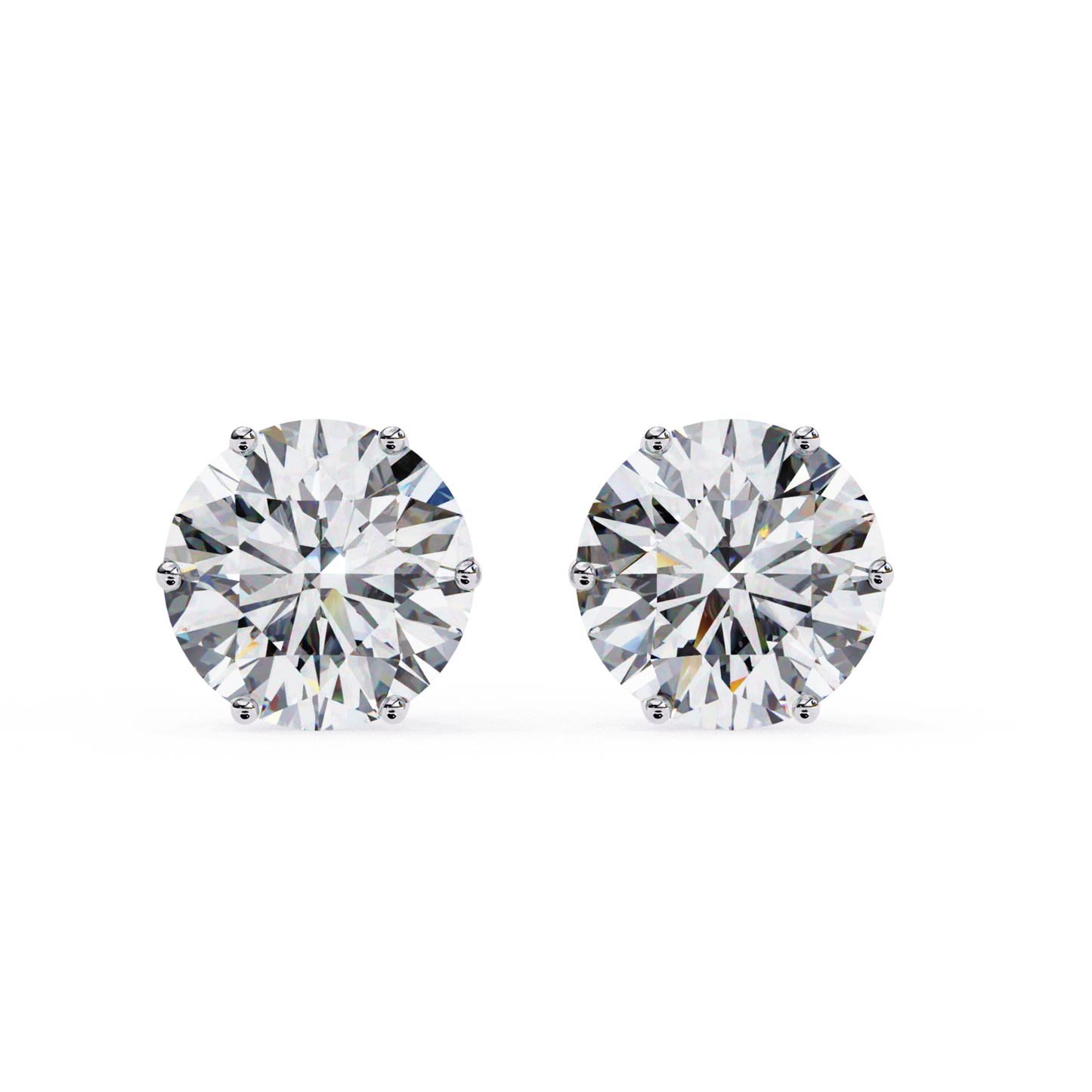 pair of white gold earrings 
