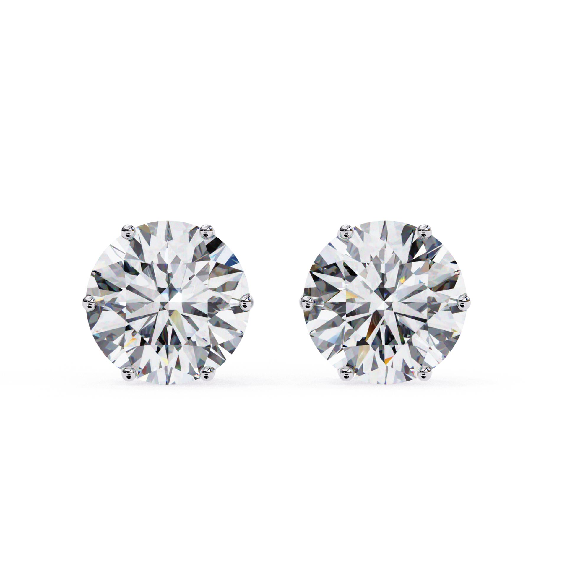 pair of white gold earrings 

