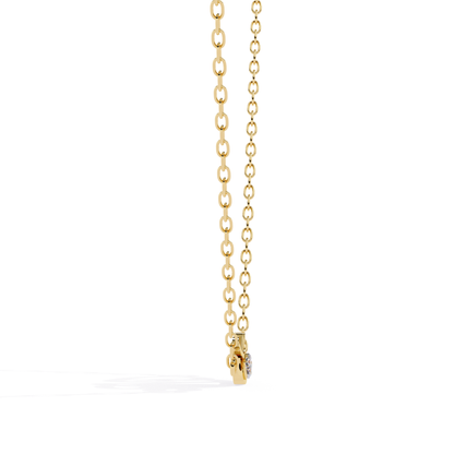 Side view of a yellow gold love script pendant featuring a heart-shaped diamond set within the design.