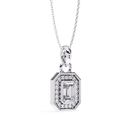 Platinum pendant showcasing an emerald cut diamond framed by diamonds.