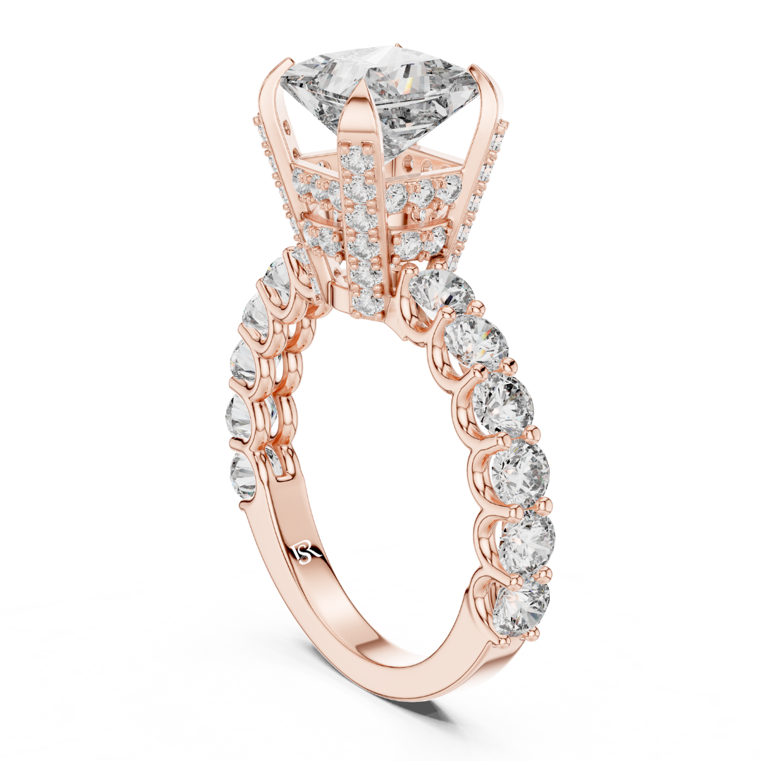 Princess cut diamond ring rose gold
Rose gold princess cut diamond ring side view
Diamond ring with round side stones rose gold
Princess cut diamond ring detailed basket view
Rose gold diamond ring luxury band
Princess cut diamond ring side profile
Rose gold diamond ring premium finish
Diamond ring with pavé side band
Princess cut diamond ring elegant design
Rose gold diamond ring product view