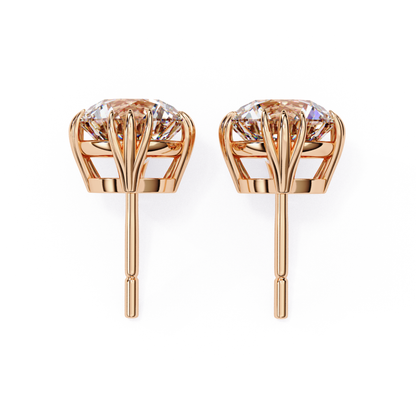 Beautiful rose gold diamond earrings featuring a crown setting, with sparkling diamonds securely held in place for a luxurious look.
