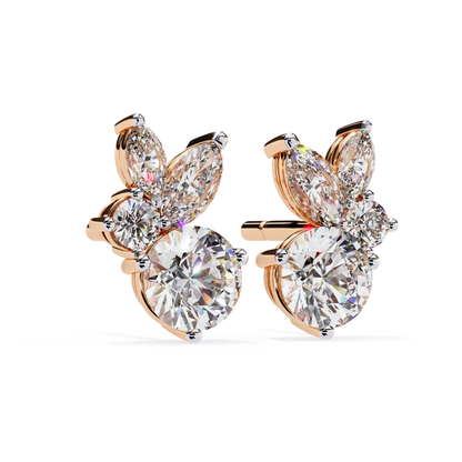 Charming rose gold stud earrings featuring a stunning round diamond, complemented by marquise and pear-shaped diamonds arranged in a graceful floral pattern for a refined, luxurious look.