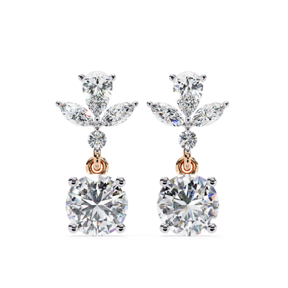 Exquisite rose gold drop earrings with a captivating round diamond at the base, accented by pear and marquise diamonds above, exuding luxury and refinement in every angle.