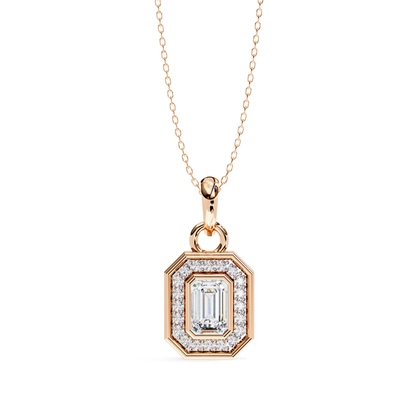 Rose gold pendant with an emerald cut diamond and a halo of smaller diamonds.