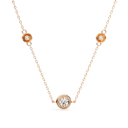 Rose gold station necklace with round bezel diamonds