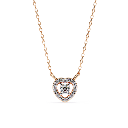  A rose gold chain necklace featuring a small heart-shaped pendant with, round-cut center diamond surrounded by a halo of smaller diamonds.
