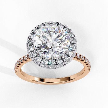 Round diamond halo ring with pave band
Diamond halo ring in rose gold
Round diamond with pave halo setting
Halo ring with round diamond and pave band
Rose gold band with halo and diamond accents
Classic round diamond in halo setting
Shining halo ring with round diamond
Round diamond surrounded by pave halo
Diamond halo ring with rose gold band
Elegant round diamond with halo