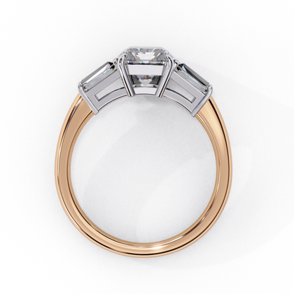 Three emerald cut diamonds in rose gold
Side view of rose gold three stone ring
Emerald cut diamonds in rose gold setting
Elegant rose gold three stone ring
Close up of emerald cut three stone ring
Top view of rose gold three stone ring
Three emerald cut diamonds in rose gold band
Rose gold band with emerald cut diamonds
Rose gold three stone ring with emerald cut diamonds
Three emerald cut diamonds in rose gold