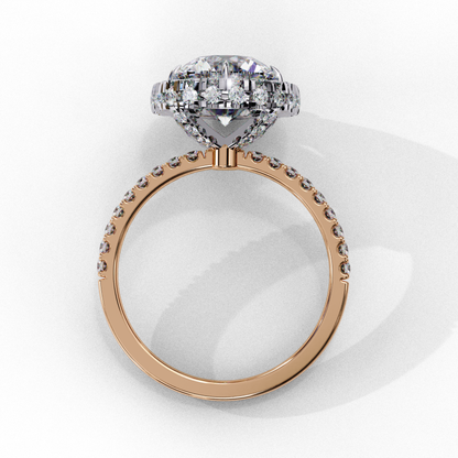 Round diamond in rose gold halo setting
Halo ring with pave diamonds in rose gold
Diamond center stone with pave accents
Rose gold halo ring with side diamonds
Round diamond with pave band in rose gold
Halo ring with diamond accents in rose gold
Diamond halo engagement ring with pave band
Rose gold band with round diamond in halo
Pave band with diamond halo ring
Halo engagement ring with round diamond