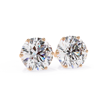 Pair of round diamond stud earrings in a six-prong white gold setting