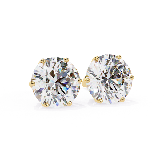 Pair of round diamond stud earrings in a six-prong yellow gold setting