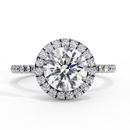Round diamond with halo of smaller diamonds
Brilliant round diamond in halo setting
Halo design featuring round diamond center
Close up of round diamond with surrounding accents
Side view of round diamond halo ring
Round diamond encircled by smaller diamonds
Round diamond in elegant halo setting
Gold band with round diamond and halo
Halo ring with central round diamond
Round diamond surrounded by smaller stones