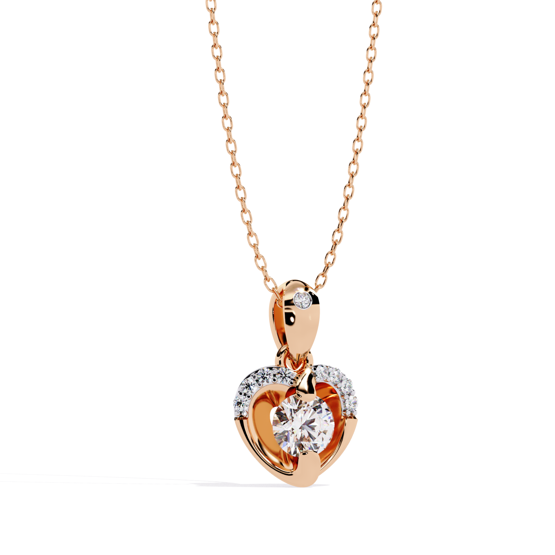 Round brilliant cut diamond heart drop pendant designed in rose gold, featuring a prong-set center diamond surrounded by a soft curved heart frame, enhanced with small round diamonds on the upper arc, polished rose gold bail with a single round diamond, front view highlighting warm metal tone and fine diamond detailing.