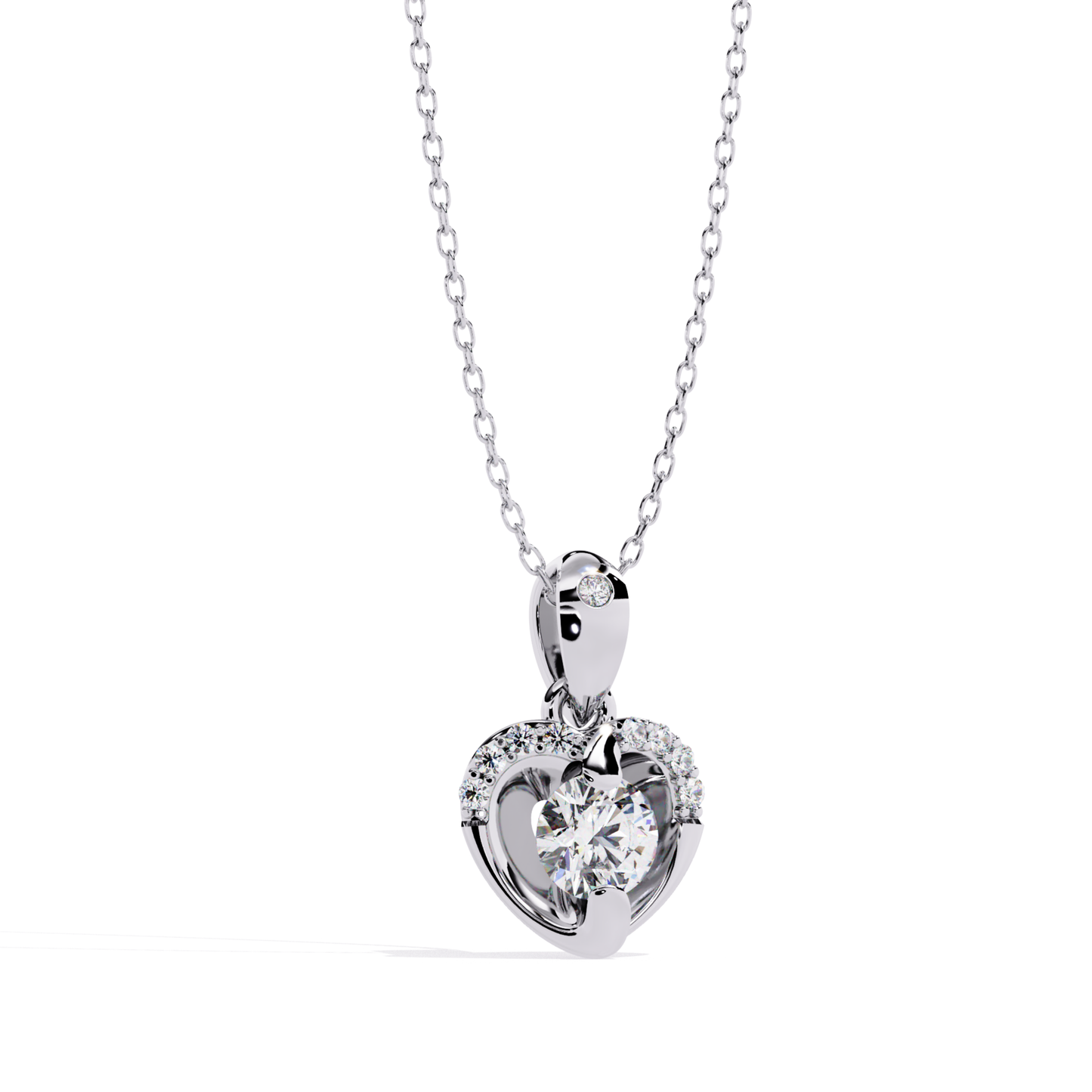 Round brilliant cut diamond heart drop pendant made in white gold, showcasing a prong-set center diamond within an open heart frame, highlighted by round accent diamonds along the top curve, sleek white gold bail set with a single round diamond, front view emphasizing clean metal lines and precise diamond placement.
