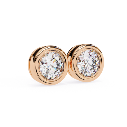 Rose gold bezel set stud earrings featuring a round diamond