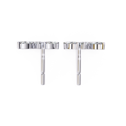  Sleek white-gold stud earrings with shimmering stones, offering an elegant and timeless look.