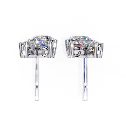 Elegant white gold pave stud earrings with a central round diamond, framed by smaller diamonds in a chic, sparkling design that radiates sophistication.