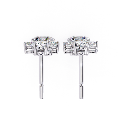 Sophisticated white gold stud earrings featuring a brilliant round diamond at the center, set in a delicate prong design for timeless elegance.