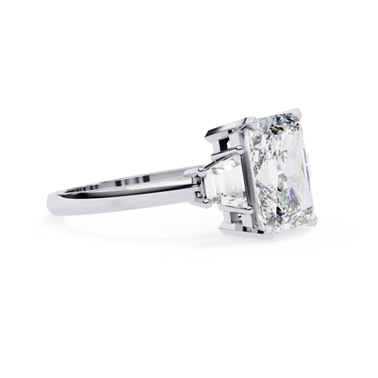 Emerald cut profile
White gold ring side
Emerald stone angle
Side setting view
White gold shank
Emerald mount detail
Side prong look
Clean band profile
Stone side angle
White gold setting