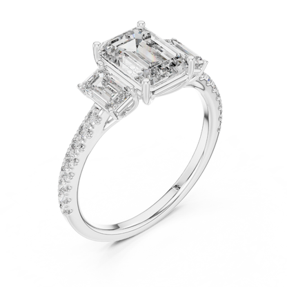 Angled view of emerald cut three stone diamond ring in white gold
White gold emerald diamond ring with pave band angled view
Emerald cut diamond engagement ring with side stones
Three stone emerald diamond ring in white gold perspective view
White gold ring with emerald cut center diamond angled view
Emerald cut lab diamond ring with pave band in white gold
Minimal white gold emerald diamond engagement ring angled view
Pave band three stone diamond ring perspective angle
Classic emerald cut engagement ring 