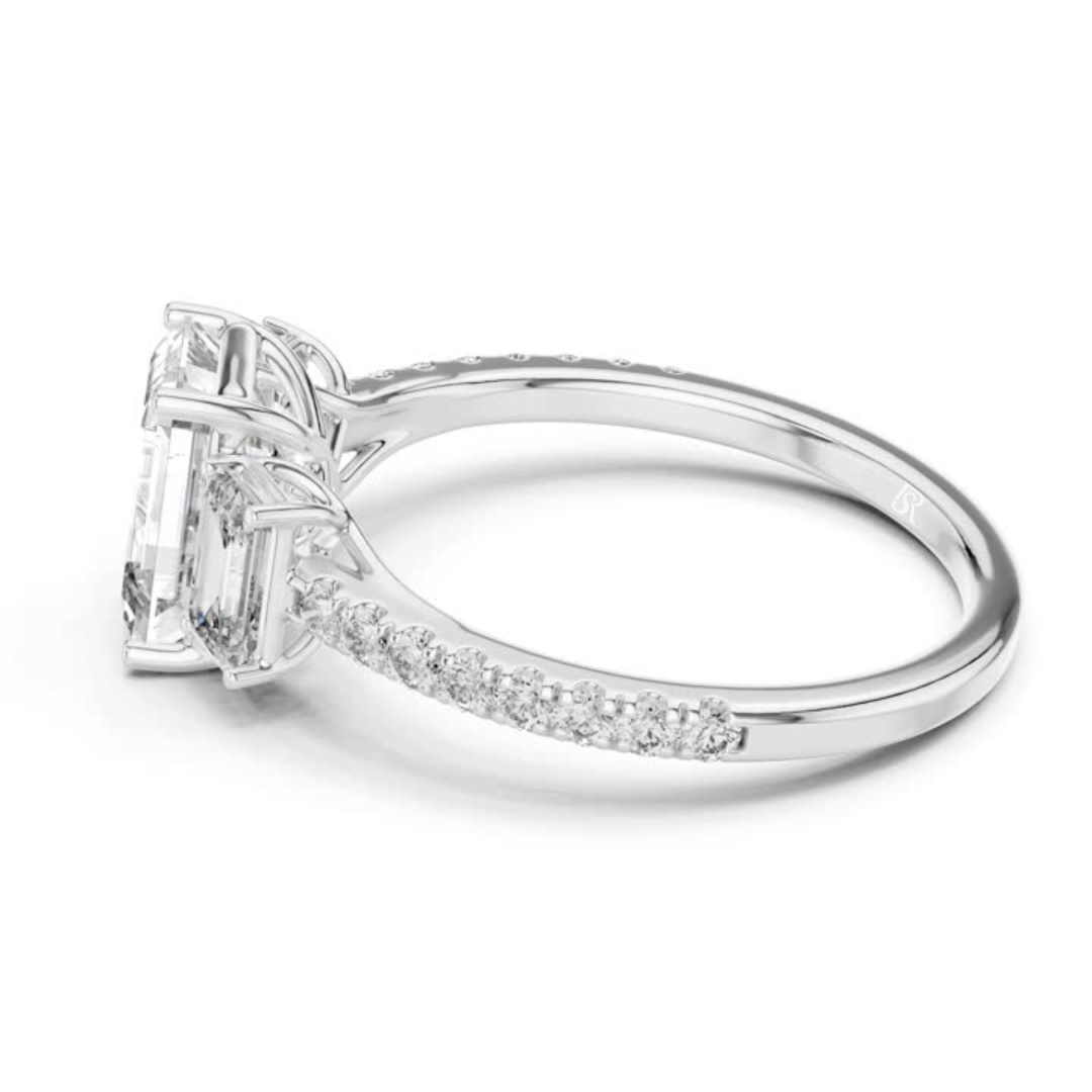 Side view of emerald cut three stone diamond ring in white gold
White gold emerald diamond ring with pave band side view
Emerald cut diamond engagement ring side profile
Three stone emerald diamond ring in white gold side angle
White gold ring with emerald cut diamonds side view
Emerald cut lab diamond ring with pave band profile
Minimal white gold emerald diamond ring side view
Side profile of three stone diamond ring with pave band
Classic emerald cut engagement ring in white gold side view
White gold pav