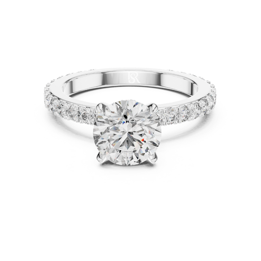 White gold round diamond solitaire engagement ring
Round cut diamond ring with pave band
White gold solitaire ring front view
Classic round diamond engagement ring in white gold
Pave diamond band with round center stone
Minimalist white gold diamond solitaire ring
Round brilliant diamond ring with slim pave band
White gold prong set diamond engagement ring
Elegant solitaire diamond ring close up
Front view white gold round diamond ring