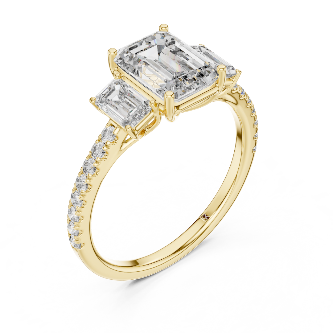 Angled view of emerald cut three stone diamond ring in yellow gold
Yellow gold emerald diamond ring with pave band angled view
Emerald cut diamond engagement ring with side stones
Three stone emerald diamond ring in yellow gold perspective view
Yellow gold ring with emerald cut center diamond angled view
Emerald cut lab diamond ring with pave band in yellow gold
Minimal yellow gold emerald diamond engagement ring angled view
Pave band three stone diamond ring perspective angle
Classic emerald cut engagement