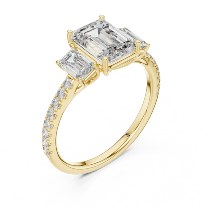 Angled view of emerald cut three stone diamond ring in yellow gold
Yellow gold emerald diamond ring with pave band angled view
Emerald cut diamond engagement ring with side stones
Three stone emerald diamond ring in yellow gold perspective view
Yellow gold ring with emerald cut center diamond angled view
Emerald cut lab diamond ring with pave band in yellow gold
Minimal yellow gold emerald diamond engagement ring angled view
Pave band three stone diamond ring perspective angle
Classic emerald cut engagement