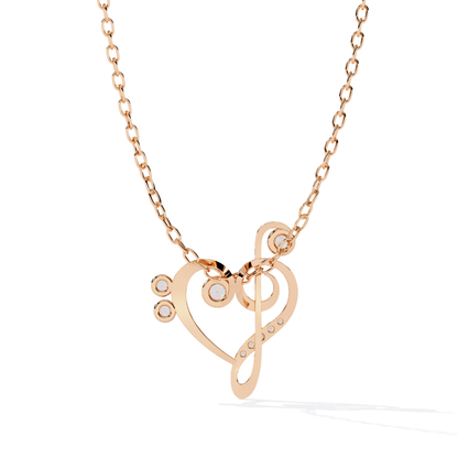 Rose gold necklace with a heart and music note pendant 