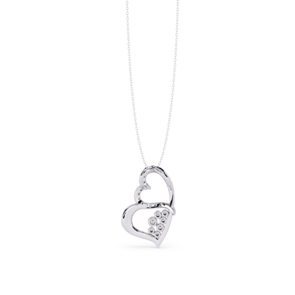 back view of white gold heart shaped diamond pendant with chain showing round cut diamonds placed in pave setting with clean metal finish and slim profile