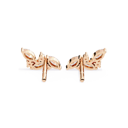 Rose gold butterfly earrings on a white background