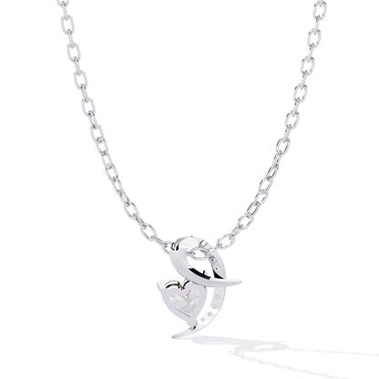 Back view of white gold heart pendant highlighting polished metal finish and open back setting