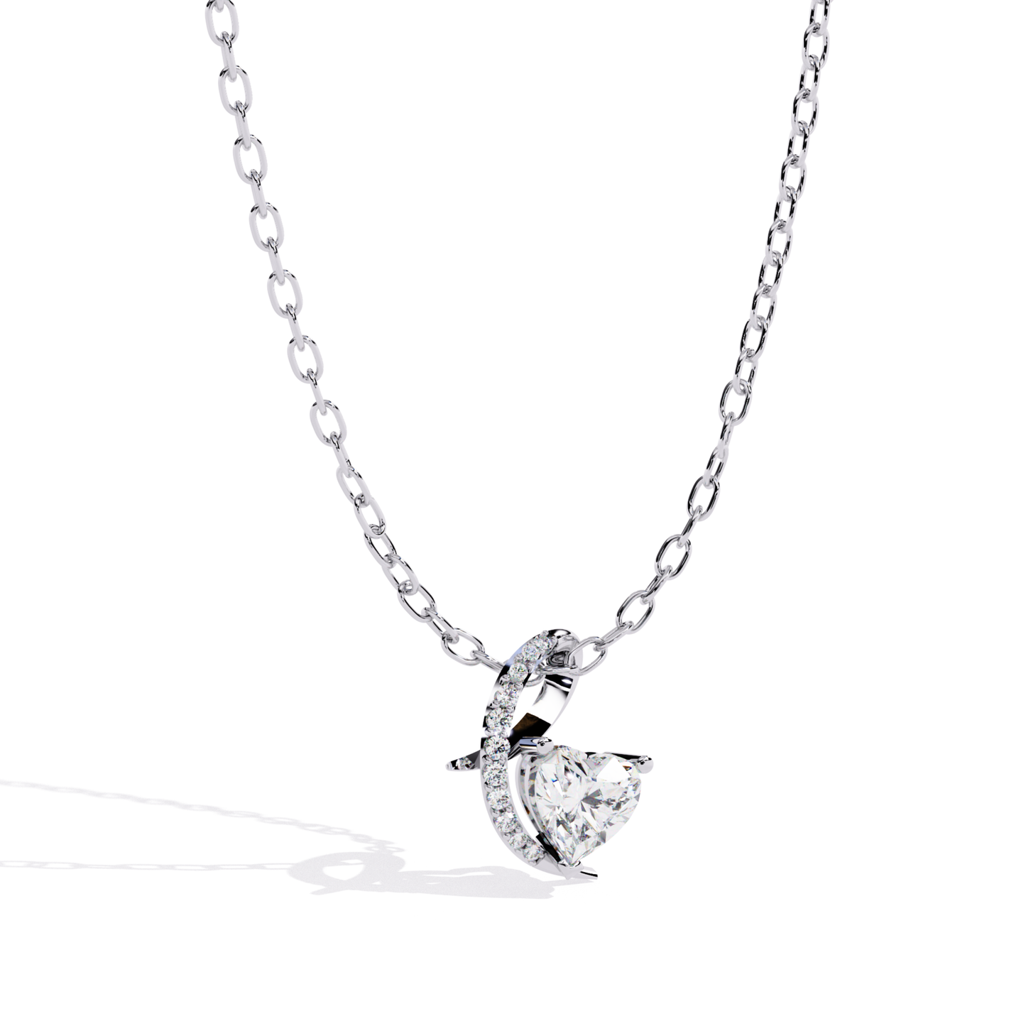 White gold heart pendant featuring a brilliant cut diamond and curved pavé detail