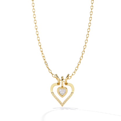 heart shape diamond pendant in yellow gold with open heart design featuring heart cut center diamond and small round diamonds set along the lower curve