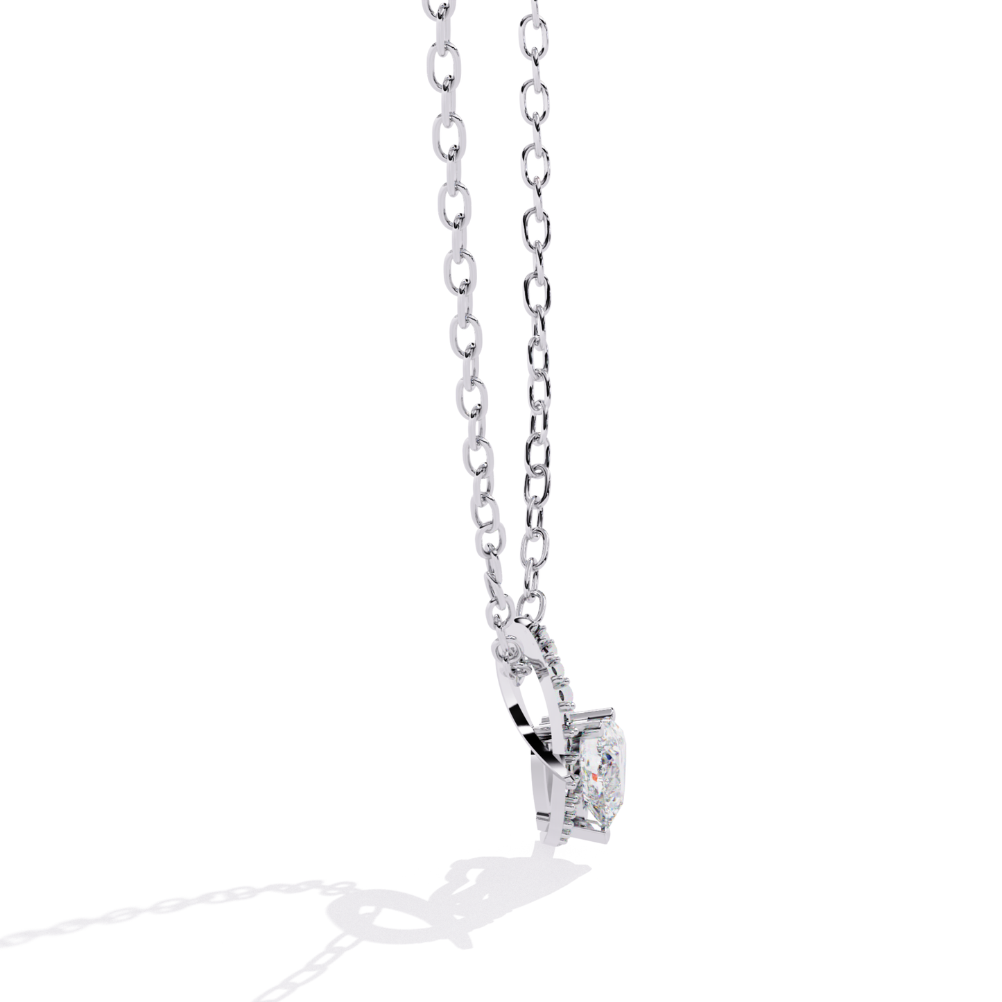 Side view of white gold heart pendant with visible diamond mount and smooth metal curve