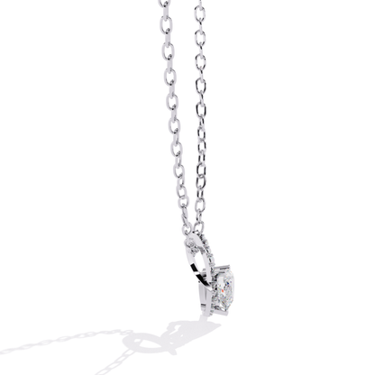 Side view of white gold heart pendant with visible diamond mount and smooth metal curve
