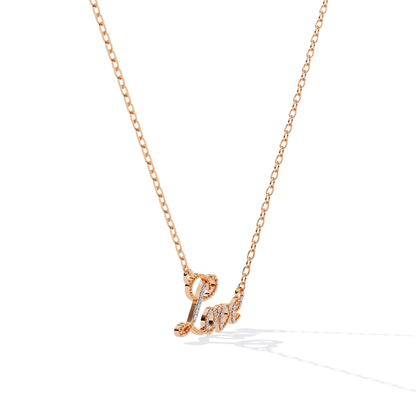 Rose gold love word necklace shown from the side to display depth and stone setting