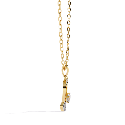 Yellow gold music note pendant with heart detail and stone accents shown from the front