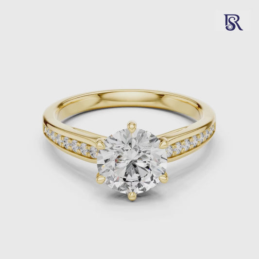 Round center diamond ring with side stones
Round diamond ring detailed band view
Round cut diamond ring front angle
Round diamond ring fine band setting
Round center diamond ring clean look
Round diamond ring close design view
Round diamond ring elegant band style
Round center diamond ring studio image
Round diamond ring refined jewellery look
Round diamond ring balanced design view