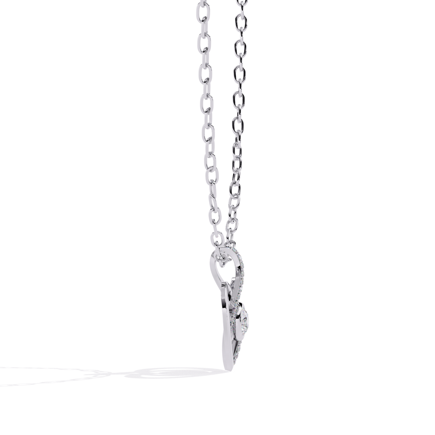 white gold heart shaped pendant displaying side profile with floating diamond center and round set detailing