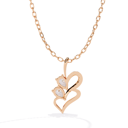 Rose gold heart-shaped necklace with a small heart pendant on a white background